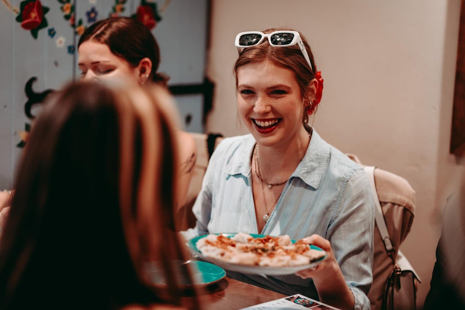 Friends sharing food together on a hosted Krakow experience