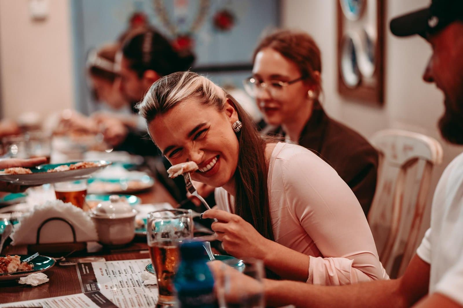 Guest smiling while tasting pierogi on the Krakow food tour